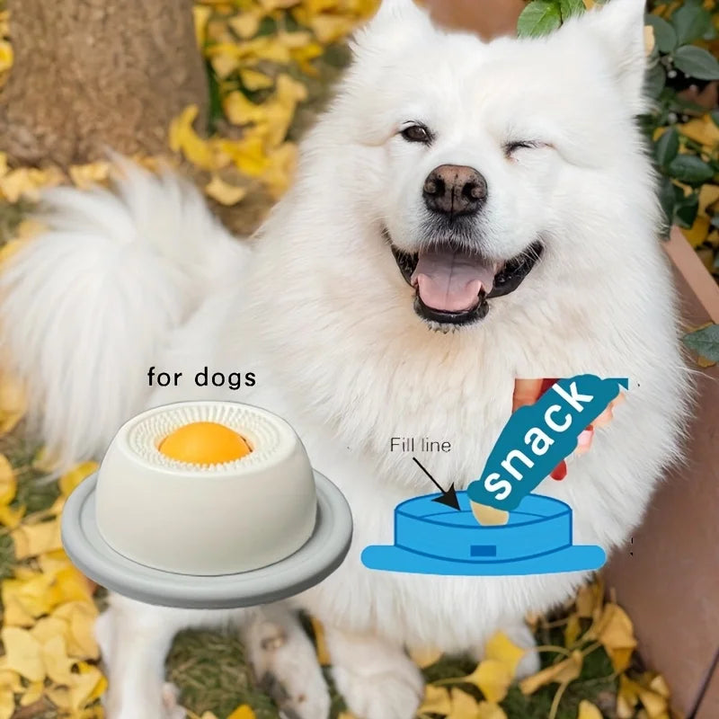 Dog using the orange Interactive Lick Mat Slow Feeder Bowl filled with snack treats