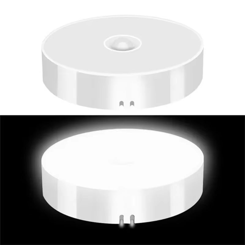 Round PIR motion sensor LED night light shown off in daylight and glowing bright white in the dark.