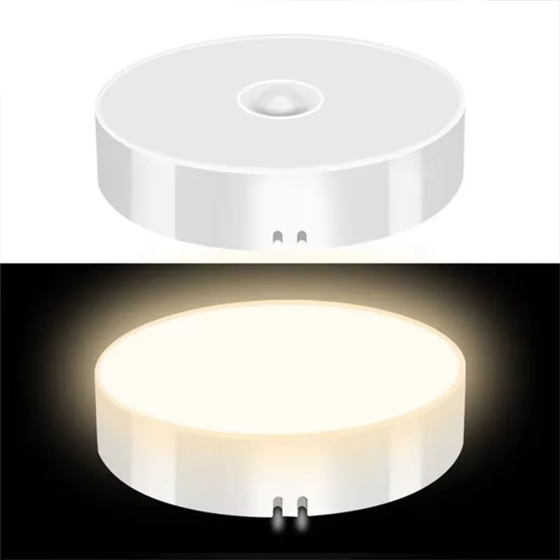 Round PIR motion sensor night light shown off in daylight and glowing warm amber light in the dark.