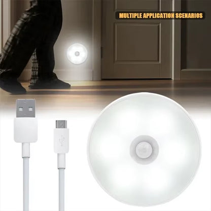 Round PIR night light in hallway application with person walking by, plus included USB and micro-USB charging cables.